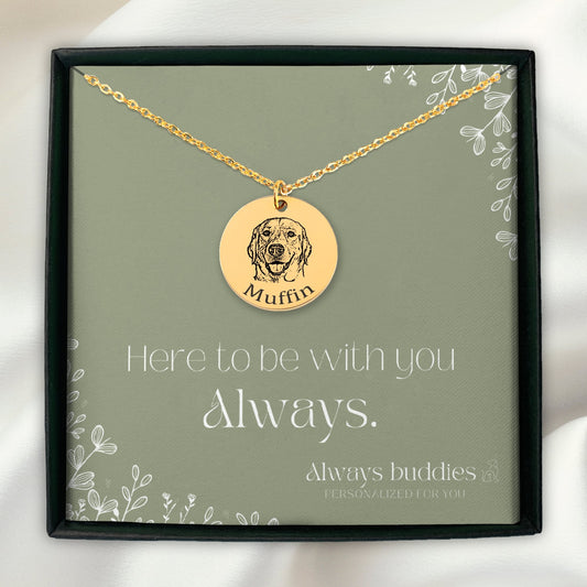 A silver and gold necklace with an engraved pendant featuring a detailed image of a cute pet